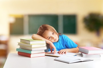 School child in classroom.