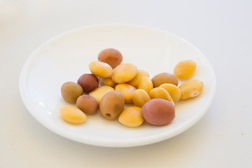 Spanish appetizers consisting of pickled olives and white beans