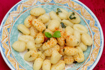 Plate of gnocchi with basil