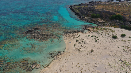 Obraz premium Aerial drone panoramic view photo of famous exotic paradise sandy deep turquoise beach of Elafonissi in South West Crete island, Greece