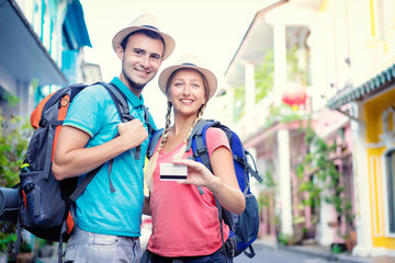 Travelers showing bank card.
