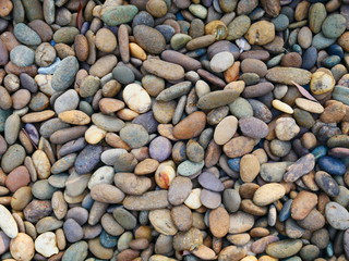 smooth pebbles beach background, brown stone