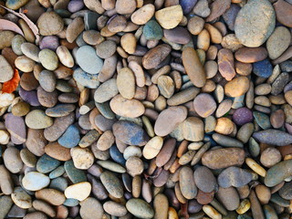 smooth pebbles beach background, brown stone