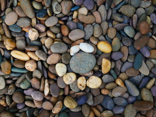 smooth pebbles beach background, brown stone