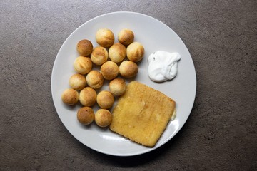 Fried cheese with potato croquettes and tartar sauce. 
