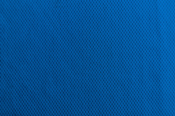 Fototapeta na wymiar A uniformly lit blue fabric texture with soft shadows.