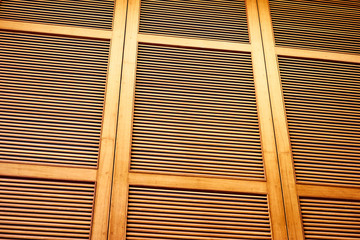 Wooden shutters, louvers. Textured background.
