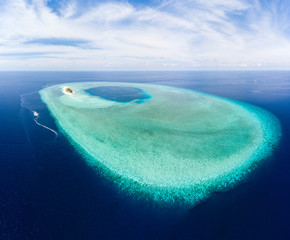 Aerial: tropical atoll view from above, blue lagoon turquoise water coral reef, Wakatobi Marine...