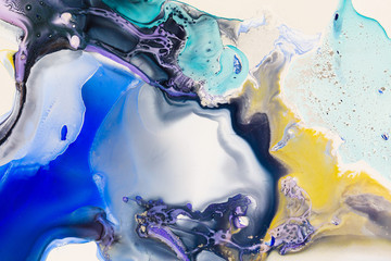 Liquid paper yellow purple blue paint background. Fluid painting abstract texture, art technique....