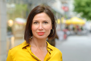 Attractive stylish middle aged woman in town
