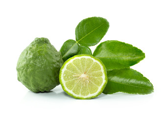 Fresh Bergamot fruits cut in half with leaves isolated on white background