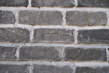Gray brick wall with white seams