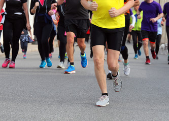 Fototapeta na wymiar marathon with many runners running during the foot race