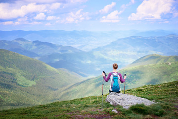 Active lifestyle. Traveling, hiking and trekking concept. Young woman with backpack in the Carpathian mountains.