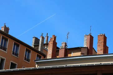 French style chimneys above the roof of the European house
