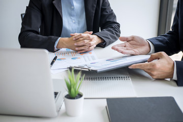 Obraz premium Business team colleagues discussing working analyzing with financial data and marketing growth report graph in team consultation to grow up profit, Meeting Talking Brainstorming Communication Concept