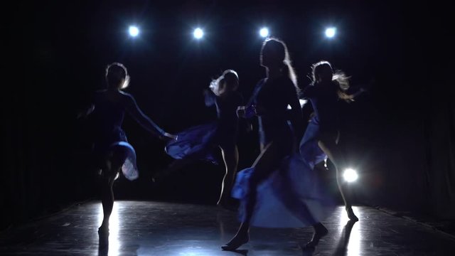 Four graceful woman are dancing elements of modern ballet