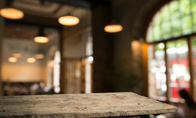 blurred background of bar and dark brown desk space of retro wood
