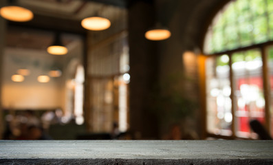 blurred background of bar and dark brown desk space of retro wood