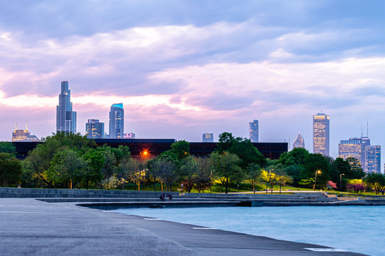 A colorful urban sunset at Lake Michigan. Lakefront cityscape in Chicago, Illinois.