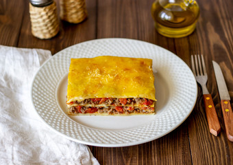 Lasagna on a wooden background. Italian cuisine.