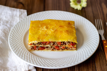 Lasagna on a wooden background. Italian cuisine.