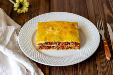 Lasagna on a wooden background. Italian cuisine.