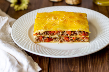 Lasagna on a wooden background. Italian cuisine.