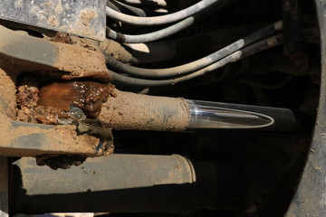 Hydraulic pistons and pipes of a large bulldozer.