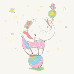 Lovely cute elephant stands on the colorful ball. Young dressed rhino in the children's summer dress in polka dots, with the flowers on the head.