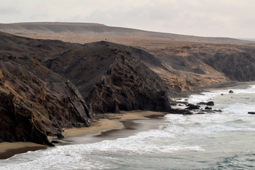 Beautiful panoramic view of rocky coast of the Atlantic Ocean. Wild beach on La Pared, Fuerteventura Canary Islands, Spain
