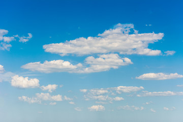 white cumulus clouds on blue sky natural background