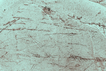 Vintage cyan background. Rough painted wall of hazel color. Imperfect plane of brown colored. Uneven old decorative toned backdrop of blue tint. Texture of azure hue. Ornamental stony surface.