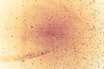 Vintage yellow background. Rough painted wall of aspen gold color. Imperfect plane of golden colored. Uneven old decorative toned backdrop of yellow tint. Texture of gold hue. Ornamental stony surface