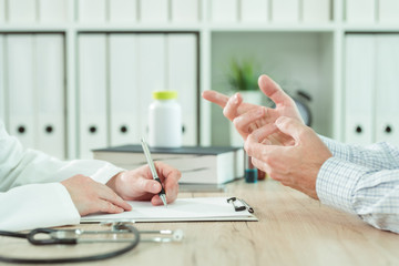Doctor and patient during consultation in medical office