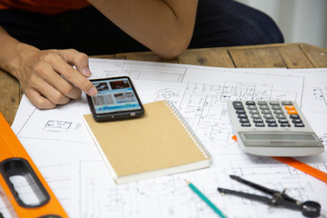 Architect Designing in blueprint at Construction Site With drawing equipment.concept