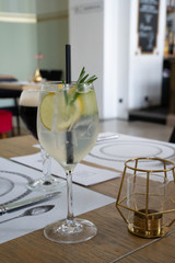 Cold gin tonic cocktail on a table in luxury cafe and restaurant interior
