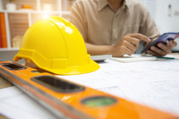 Architect Designing in blueprint at Construction Site With drawing equipment.concept