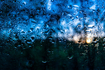 macro shot of a water drops on a window after rainy day, abstract background and textures