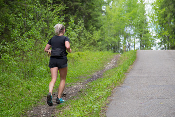Fototapeta premium The girl runs through the Park.