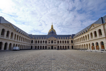 Obraz premium Scenic view of catholic cathedral (Les Invalides) in old touristic historic city Paris. Beautiful summer happy look of old christian temple in ancient capital of France