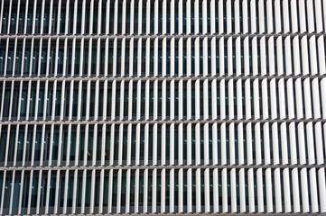 Modern office building with vertical shutters to screen the sun