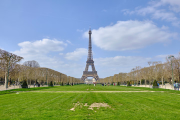 Scenic view of famous Eiffel Tower in old touristic historic city Paris. Beautiful summer happy look of most popular touristic attraction in ancient capital of France