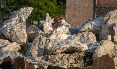 Pallets with natural facing stone and cobblestones