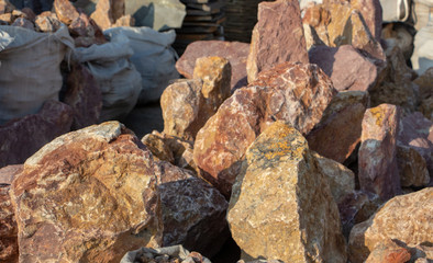 Pallets with natural facing stone and cobblestones
