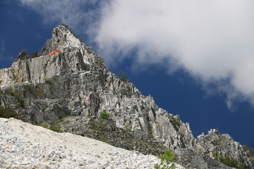 White Carrara marble quarry in the Apuan Alps. A mountain peak n