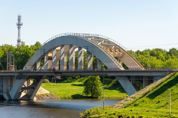 Fototapeta na wymiar Railway bridge over the river in Khimki city, Russia