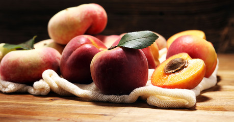 A group of ripe peaches on table