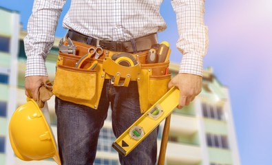 Worker with a tool belt. Isolated over  background.