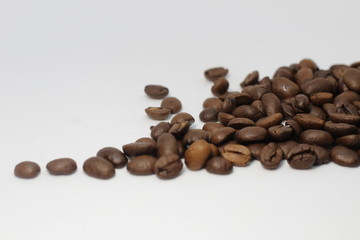 grains of black coffee flavored on the table